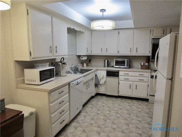 4343 W Bancroft St Unit 2D, Toledo, OH 43615 - kitchen featuring white appliances, a sink, light countertops, and light flooring