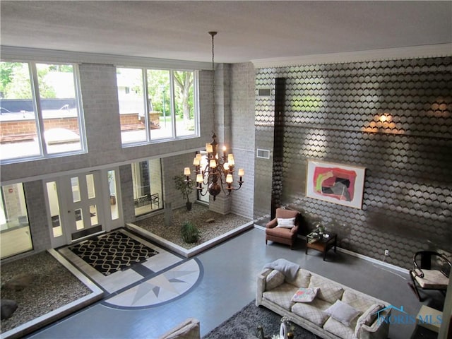 4343 W Bancroft St Unit 2D, Toledo, OH 43615 - living room featuring a chandelier