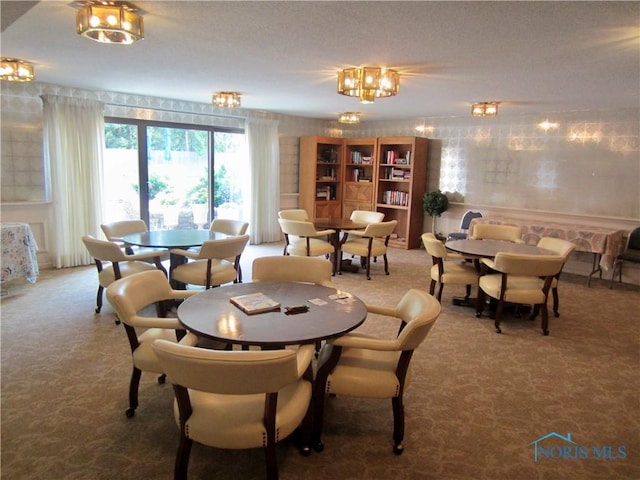 4343 W Bancroft St Unit 2D, Toledo, OH 43615 - dining area featuring carpet and a chandelier