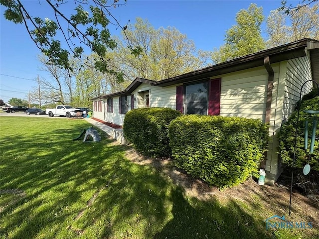 1951 S Clinton St, Defiance, OH 43512 - view of home's exterior featuring a lawn