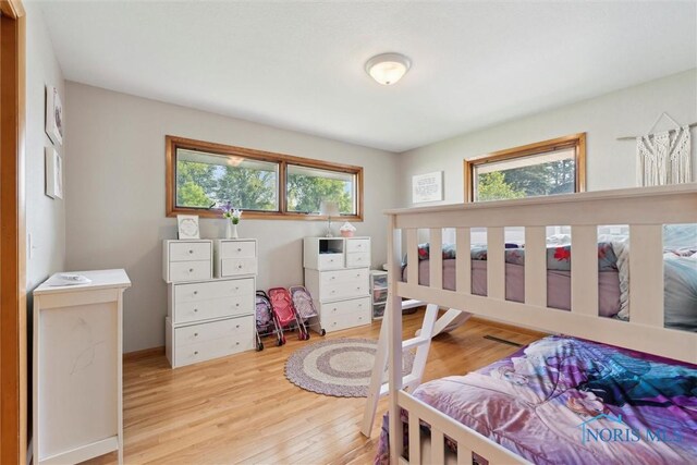 955 Westmont Ave, Napoleon, OH 43545 - bedroom with multiple windows and light wood-type flooring