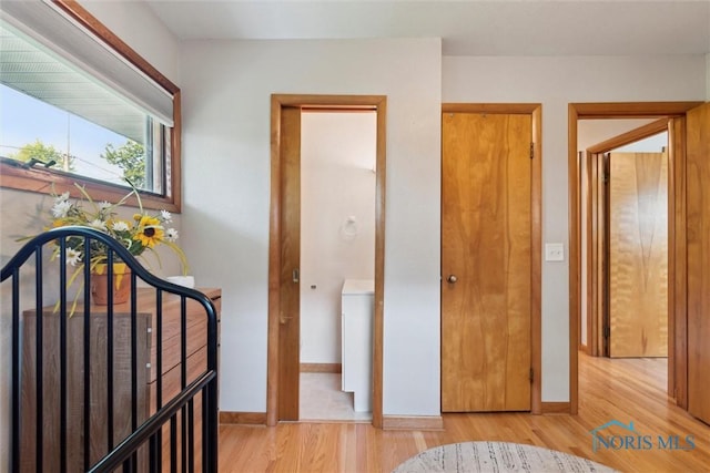 955 Westmont Ave, Napoleon, OH 43545 - bedroom featuring light wood finished floors and washer / dryer