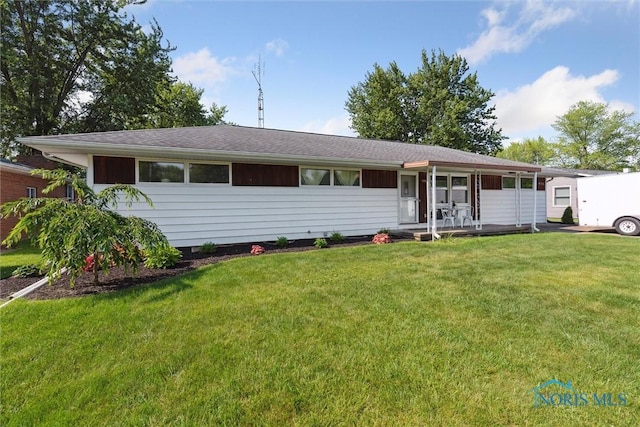 955 Westmont Ave, Napoleon, OH 43545 - ranch-style house featuring covered porch and a front yard