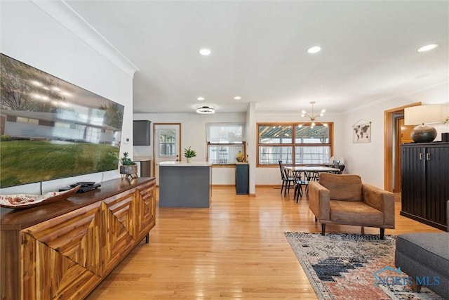 955 Westmont Ave, Napoleon, OH 43545 - living room featuring light wood-type flooring, recessed lighting, crown molding, and a chandelier