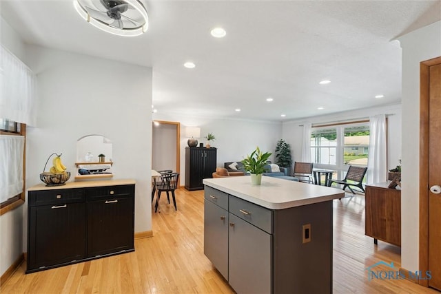955 Westmont Ave, Napoleon, OH 43545 - kitchen with light countertops, a kitchen island, light wood-style flooring, and recessed lighting