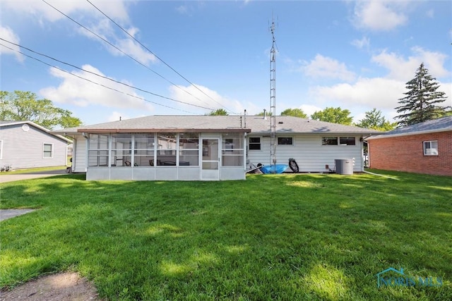 955 Westmont Ave, Napoleon, OH 43545 - back of house with a sunroom and a yard