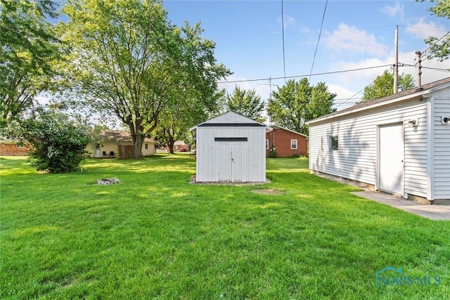 955 Westmont Ave, Napoleon, OH 43545 - view of grassy yard featuring a shed