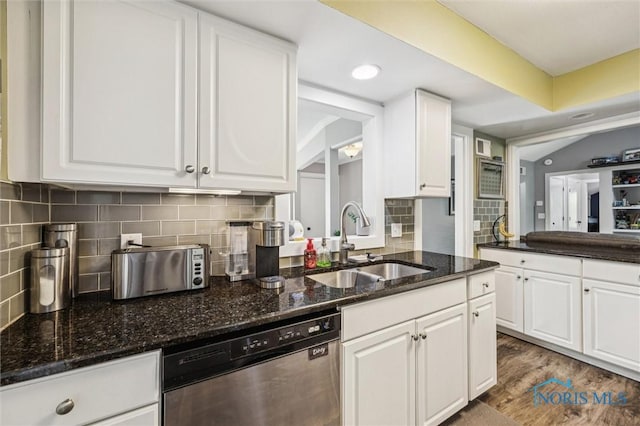 29674 E River Rd, Perrysburg, OH 43551 - kitchen with stainless steel dishwasher, a sink, white cabinetry, backsplash, and recessed lighting