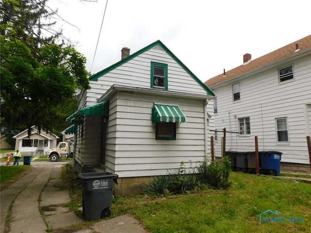 1839 Talbot St, Toledo, OH 43613 - back of house featuring a chimney