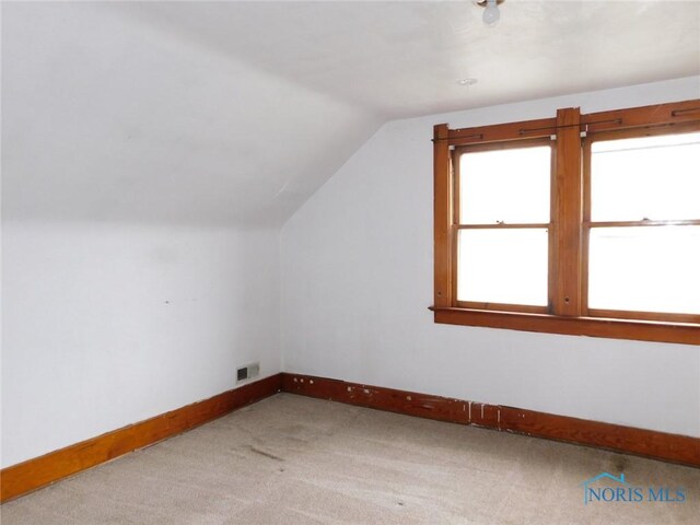 1839 Talbot St, Toledo, OH 43613 - additional living space featuring lofted ceiling, baseboards, and carpet floors