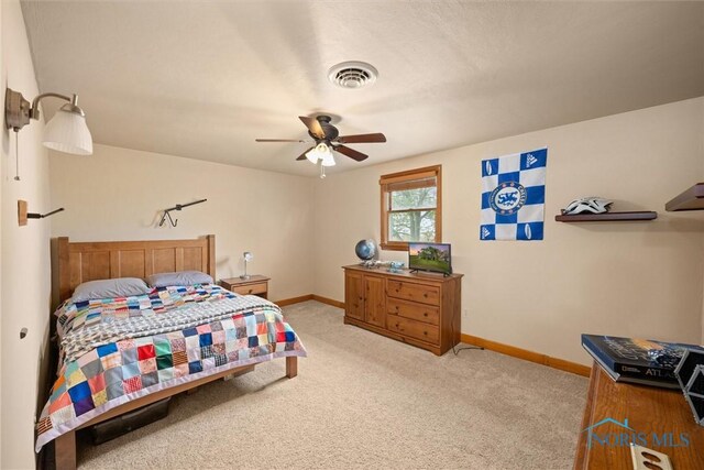 15819 County Road D, Wauseon, OH 43567 - bedroom with baseboards, light carpet, and a ceiling fan