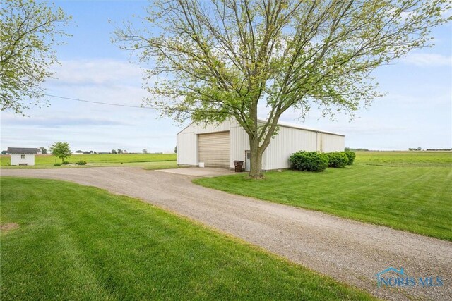 15819 County Road D, Wauseon, OH 43567 - view of pole building featuring driveway and a yard