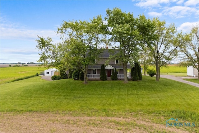 15819 County Road D, Wauseon, OH 43567 - view of front of home featuring covered porch and a front yard