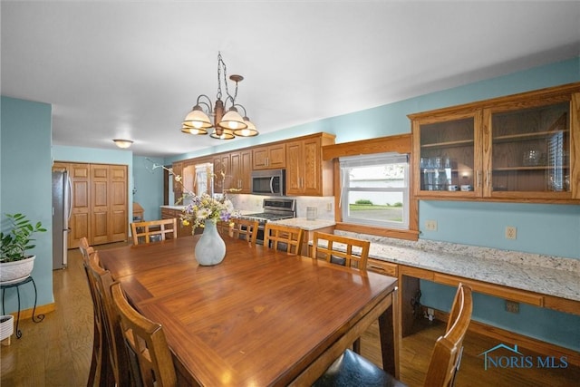 15819 County Road D, Wauseon, OH 43567 - dining room featuring a chandelier and wood finished floors