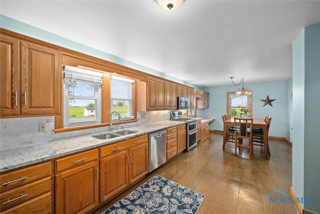 15819 County Road D, Wauseon, OH 43567 - kitchen featuring stainless steel appliances, a sink, backsplash, and plenty of natural light