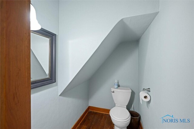 15819 County Road D, Wauseon, OH 43567 - bathroom featuring wood finished floors, baseboards, and toilet
