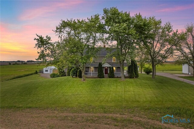 15819 County Road D, Wauseon, OH 43567 - view of front of property featuring covered porch and a yard