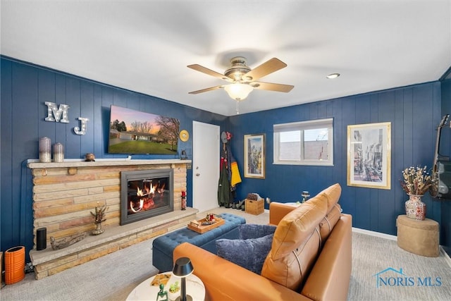 3519 Denise Dr, Toledo, OH 43614 - carpeted living area featuring a stone fireplace and a ceiling fan
