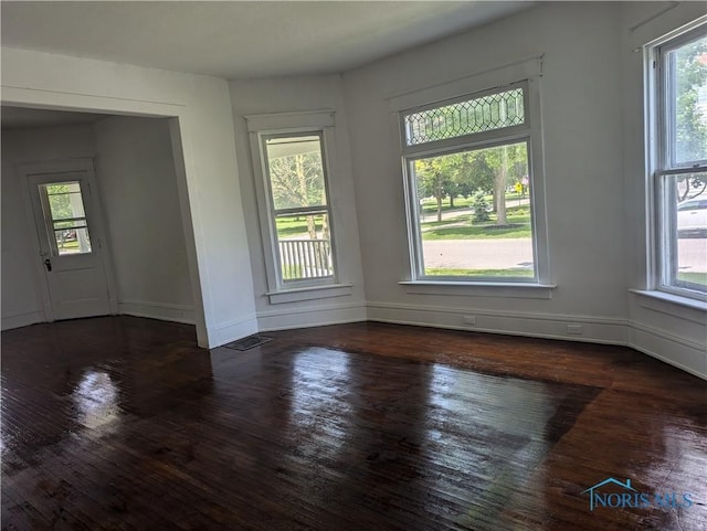 137 N 8th St, Upper Sandusky, OH 43351 - unfurnished room featuring plenty of natural light, wood-type flooring, and baseboards