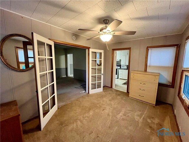 11157 State Route 500, Paulding, OH 45879 - unfurnished bedroom featuring french doors and carpet flooring