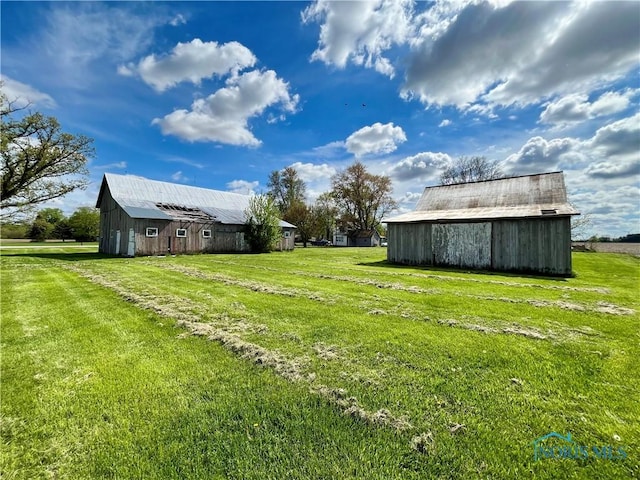 11157 State Route 500, Paulding, OH 45879 - view of grassy yard featuring a barn and an outdoor structure