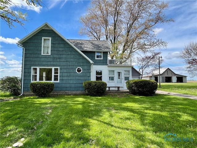 11157 State Route 500, Paulding, OH 45879 - rear view of house with a yard and a shingled roof