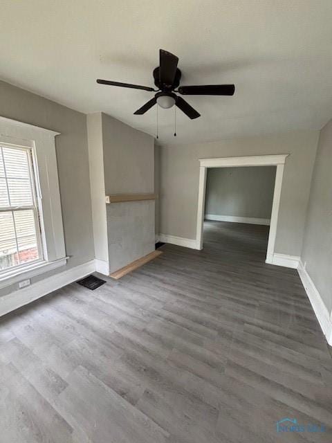 3239 Cherry St, Toledo, OH 43608 - spare room with baseboards, dark wood-style flooring, and ceiling fan