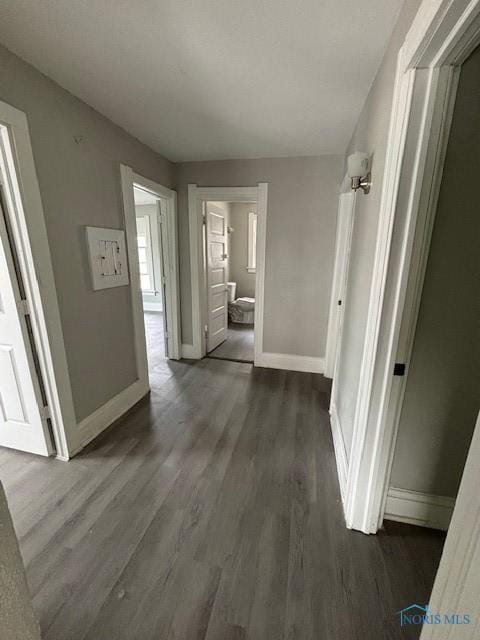 3239 Cherry St, Toledo, OH 43608 - corridor featuring dark wood-style flooring and baseboards