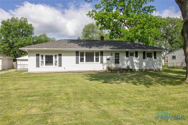 1133 Cuba St, Toledo, OH 43615 - back of property with a chimney and roof with shingles