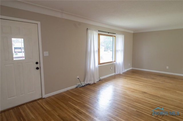 1133 Cuba St, Toledo, OH 43615 - entryway with wood finished floors, baseboards, and ornamental molding