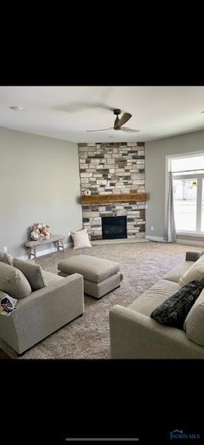 17 Crabtree Ct, Swanton, OH 43558 - living area featuring ceiling fan, a fireplace, and carpet