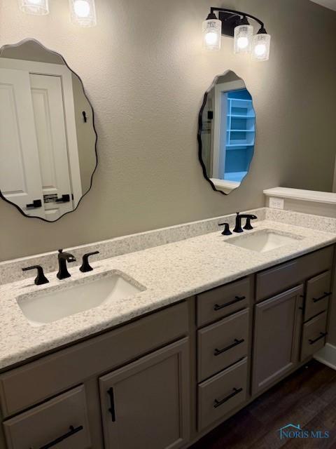 17 Crabtree Ct, Swanton, OH 43558 - bathroom with double vanity and wood finished floors
