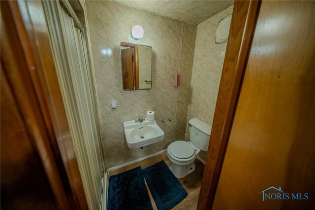 327 Klingler Rd, Paulding, OH 45879 - bathroom with a sink and wood finished floors
