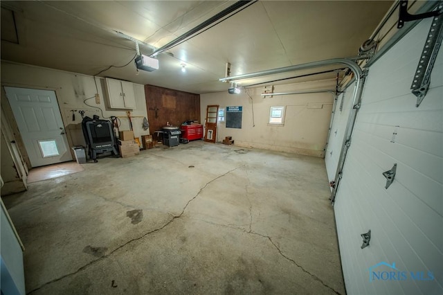 327 Klingler Rd, Paulding, OH 45879 - garage featuring a garage door opener