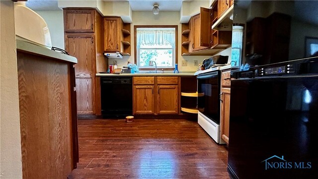 13926 Rd 154, Paulding, OH 45879 - kitchen with dishwasher, fridge, open shelves, electric range oven, and brown cabinets