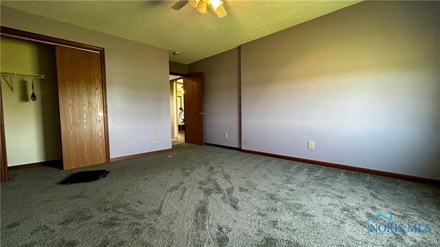13926 Rd 154, Paulding, OH 45879 - unfurnished bedroom with carpet floors, baseboards, a closet, and a ceiling fan
