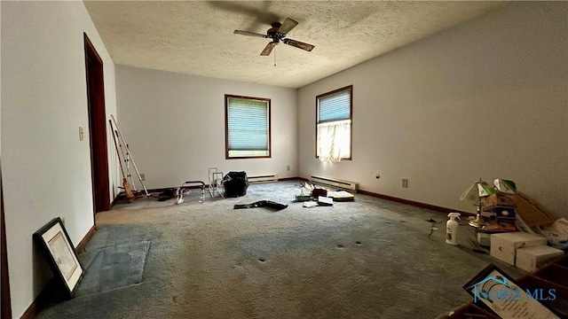 13926 Rd 154, Paulding, OH 45879 - unfurnished room with baseboard heating, a ceiling fan, carpet floors, a textured ceiling, and baseboards