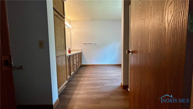 13926 Rd 154, Paulding, OH 45879 - bathroom featuring baseboards, vanity, and wood finished floors