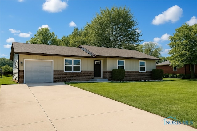 17649 Woodburn Ave, Grand Rapids, OH 43522 - single story home featuring brick siding, an attached garage, driveway, and a front yard