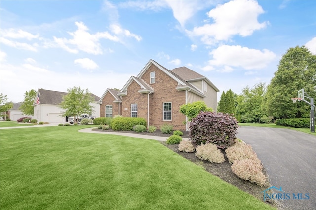 4360 Turtle Creek Dr, Perrysburg, OH 43551 - traditional-style home with brick siding and a front lawn