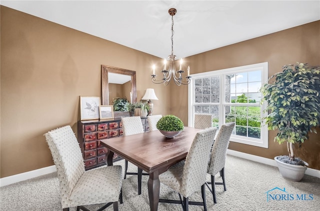 4360 Turtle Creek Dr, Perrysburg, OH 43551 - dining area with a chandelier, baseboards, and light colored carpet