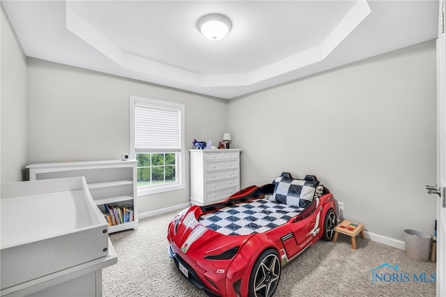 4360 Turtle Creek Dr, Perrysburg, OH 43551 - carpeted bedroom featuring a raised ceiling and baseboards