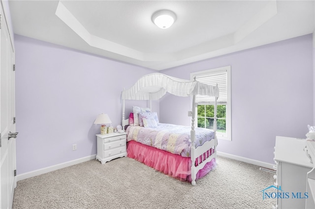 4360 Turtle Creek Dr, Perrysburg, OH 43551 - bedroom featuring a tray ceiling, carpet flooring, and baseboards
