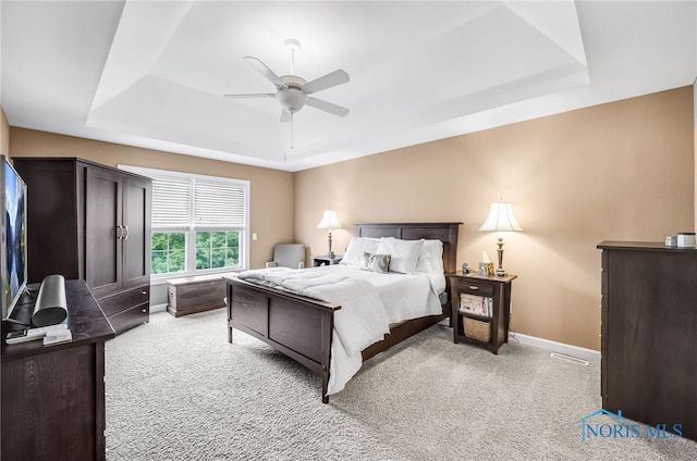 4360 Turtle Creek Dr, Perrysburg, OH 43551 - bedroom with a tray ceiling, light carpet, baseboards, and ceiling fan