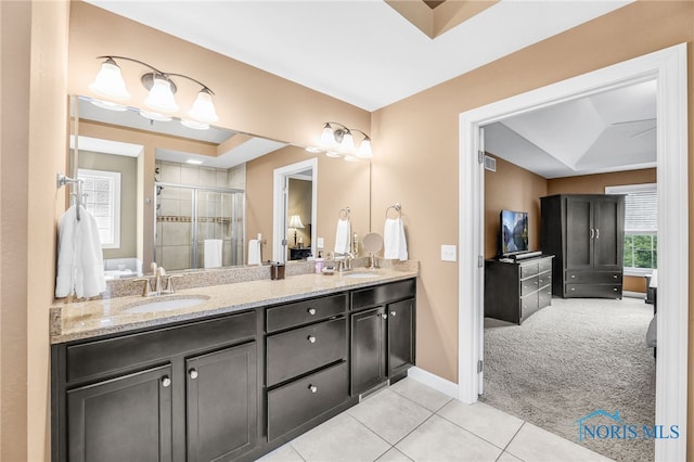 4360 Turtle Creek Dr, Perrysburg, OH 43551 - bathroom featuring double vanity, a stall shower, tile patterned floors, and baseboards