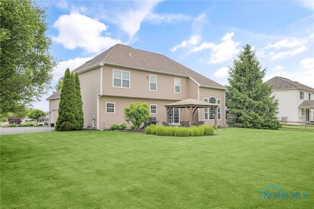 4360 Turtle Creek Dr, Perrysburg, OH 43551 - back of house with a gazebo and a yard