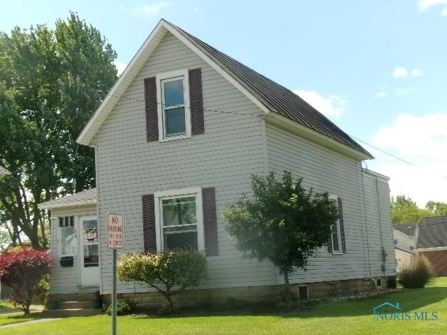 616 E 4th St, Ottawa, OH 45875 - view of home's exterior featuring a lawn
