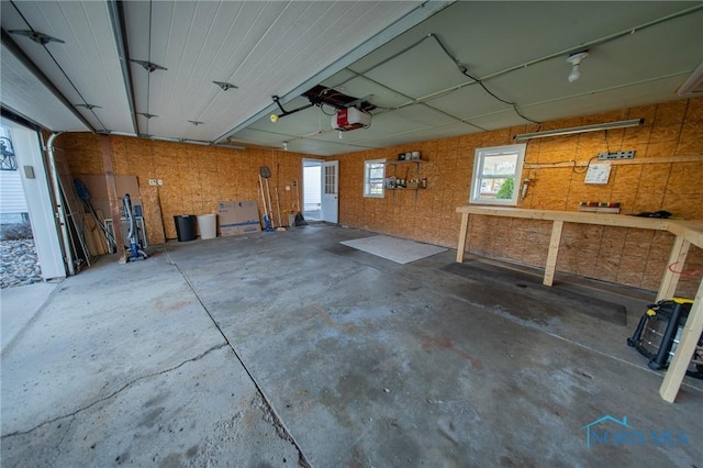 313 E Lynn St, Edgerton, OH 43517 - garage featuring a workshop area and a garage door opener
