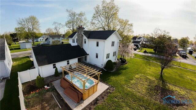 313 E Lynn St, Edgerton, OH 43517 - back of house with a chimney and a residential view