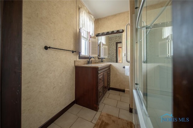 313 E Lynn St, Edgerton, OH 43517 - bathroom featuring vanity, tile patterned floors, and shower / bath combination with glass door